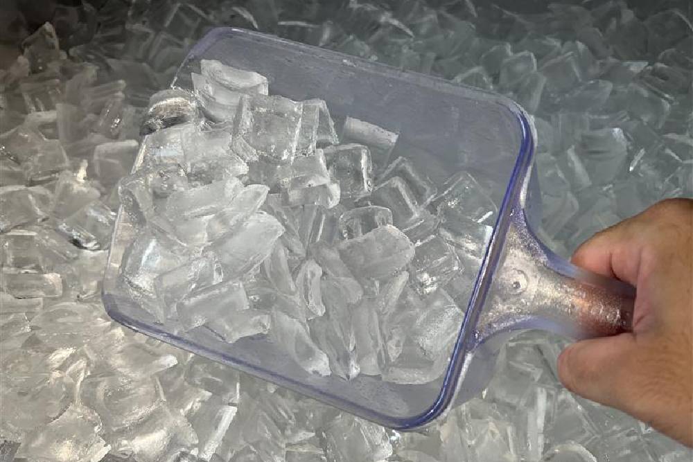 A shot of bullet ice, created by ice makers and one of the different types of ice cubes often used in quick-service settings.